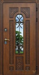 Одностворчатая входная элитная дверь со стеклом и ковкой уличная ДВ-552